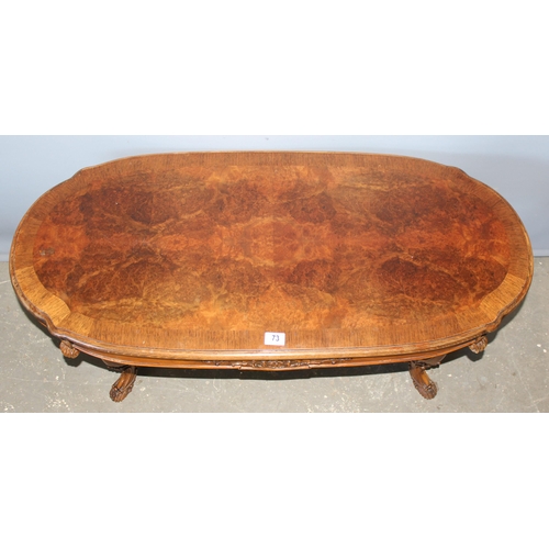 73 - A good quality 20th century walnut coffee table with carved base and legs, approx 114cm wide x 50cm ... 