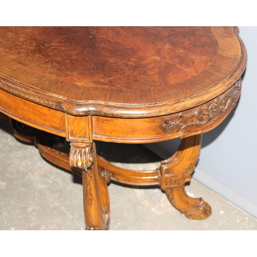 73 - A good quality 20th century walnut coffee table with carved base and legs, approx 114cm wide x 50cm ... 