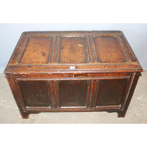 75 - An antique panelled oak coffer, likely 18th century, approx 100cm wide x 74cm deep x 70cm tall