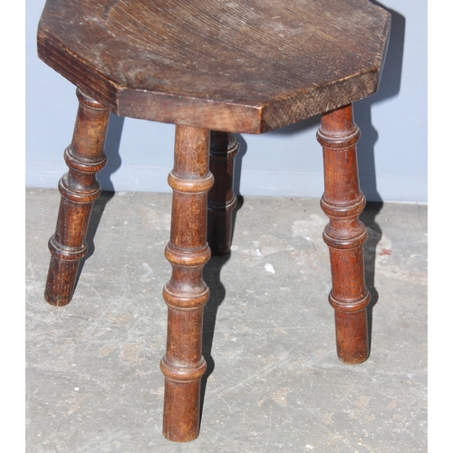 77 - A vintage Welsh oak or elm spinning chair on turned wooden legs