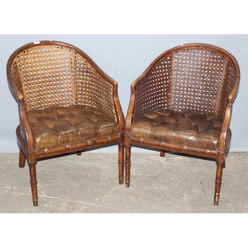 84 - In the manner of John Widdicomb, a pair of bergere and button seated tub chairs with faux bamboo eff... 