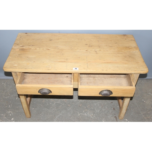 88 - A vintage pine 2 drawer desk with metal cup handles, approx 105cm wide x 52cm deep x 65cm tall