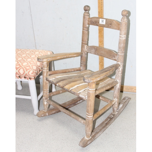 90 - A small distressed wooden child's rocking chair and a painted and upholstered footstool (2)