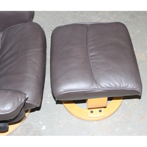 93 - An Ekornes style bentwood and leather reclining armchair and footstool, approx 94cm tall