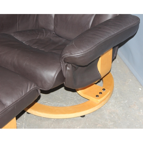 93 - An Ekornes style bentwood and leather reclining armchair and footstool, approx 94cm tall