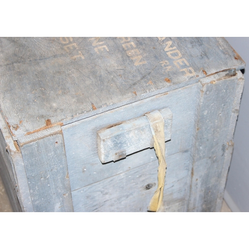 94 - A distressed painted wooden trunk with military writings, approx 60cm wide x 50cm deep x 52cm tall