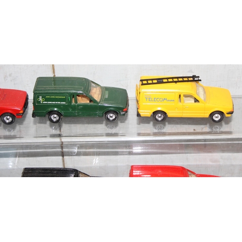 1525 - 13 x diecast Ford Escort vans some with advertising to incl Hotpoint, BT etc