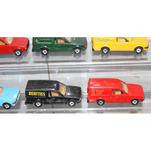 1525 - 13 x diecast Ford Escort vans some with advertising to incl Hotpoint, BT etc