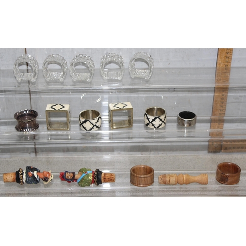 1645 - Qty of assorted bottle stoppers and a variety of napkin rings