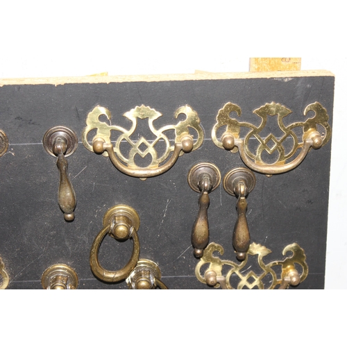 1744 - Display of antique and later handles mounted on painted black board