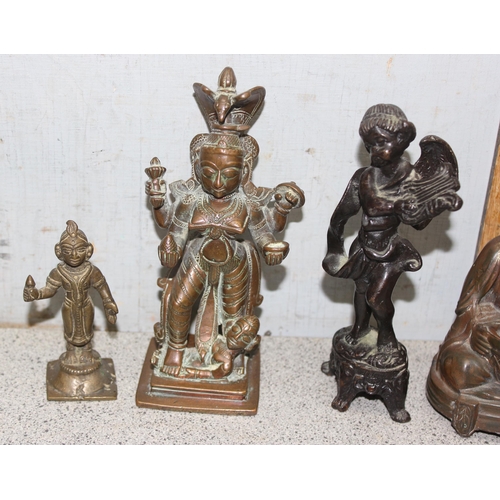 1745 - 4 small antique and later brass/copper statues to include a seated Buddha, largest approx 15cm tall