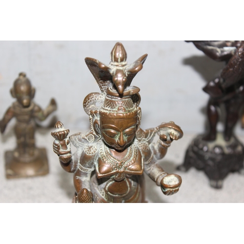 1745 - 4 small antique and later brass/copper statues to include a seated Buddha, largest approx 15cm tall