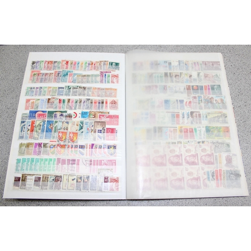 511 - 4 albums of mixed world stamps