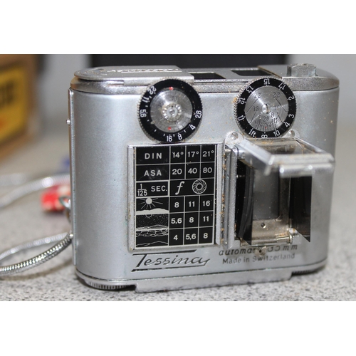 654 - A rare Tessina 35mm Subminiature camera with original strap, case, instructions and a number of film... 