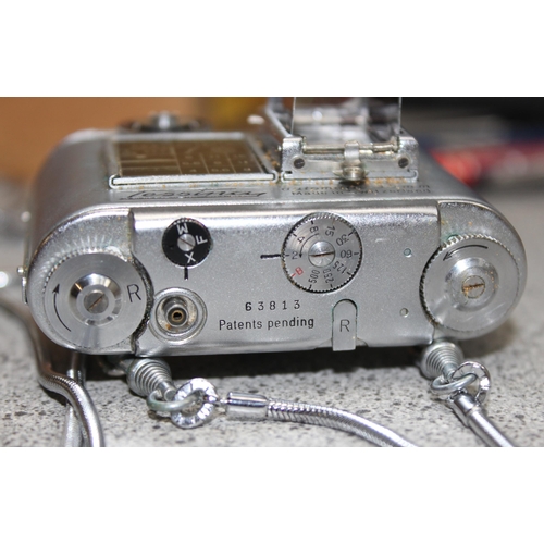 654 - A rare Tessina 35mm Subminiature camera with original strap, case, instructions and a number of film... 