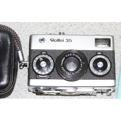 655 - A vintage Rollei 35 camera with Carl Zeiss Tessar 1:3.5 f=40mm lens, with case and instructions