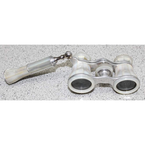 657 - A pair of mother of pearl mounted opera glasses and a cased pair of Ross Steptron 8x30 binoculars (2... 