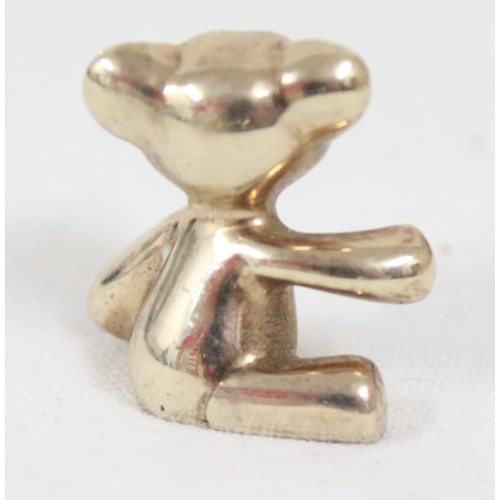 2405 - A heavy cast 9ct gold model of a teddy bear, marked for London 1982, approx 18mm tall, approx 14.34g... 