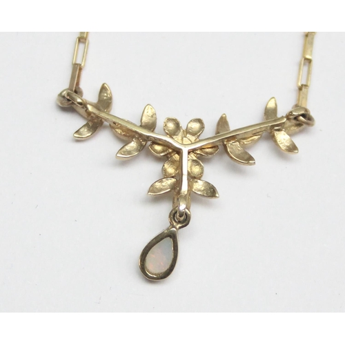 2415 - A 9ct gold necklace set with a small white stone and a small opal drop within and Art Nouveau style ... 