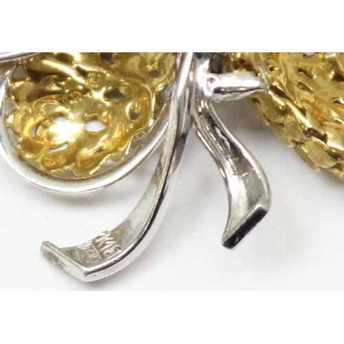 2425 - An Italian 18ct white and yellow gold brooch formed as a ribbon, the centre of the ribbon set with 5... 