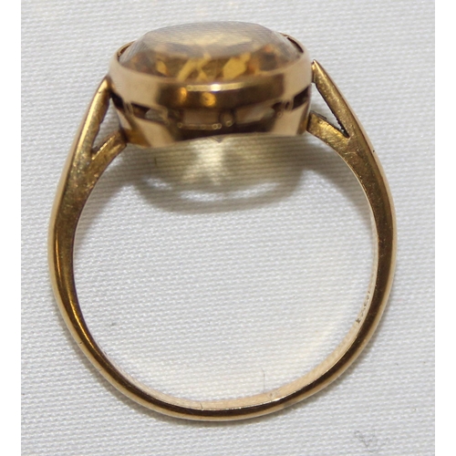 2003 - An antique 18ct gold mounted ring set with a large facet cut yellow stone, possibly a Citrine, marke... 