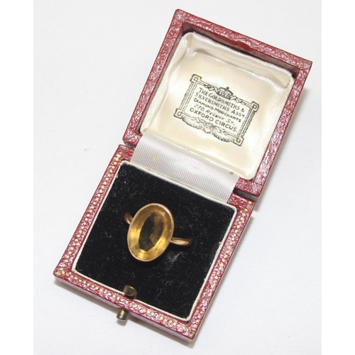 2003 - An antique 18ct gold mounted ring set with a large facet cut yellow stone, possibly a Citrine, marke... 