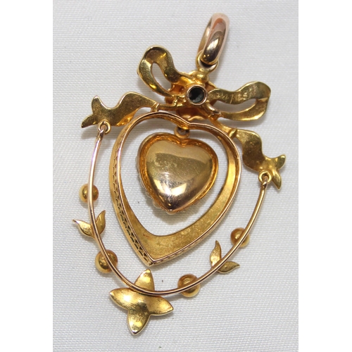 2006 - An antique 14ct gold heart shaped pendant set with diamonds, seed pearls and turquoise, seemingly un... 