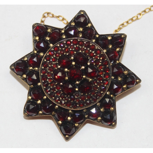 2036 - A 19th century garnet mounted star brooch, mounted in gold plated metal, approx 35mm wide