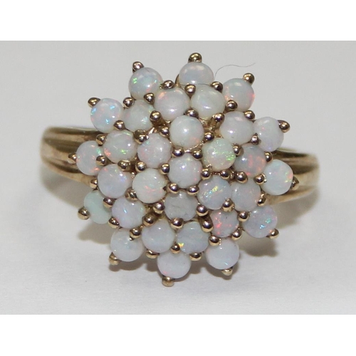 2053 - A 9ct gold opal floral cluster ring, full English hallmarks, approx size T, approx 4.01g gross