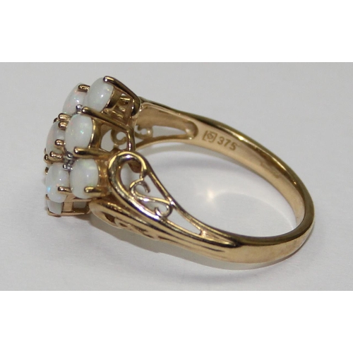 2054 - A 9ct gold opal cluster ring, full English hallmarks, approx size U, approx 3.97g gross