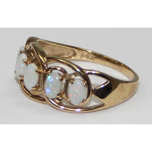 2055 - A 9ct gold ring set with a line of 5 opals, full English hallmarks, approx size T, approx 2.61g gros... 