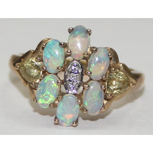 2058 - A 9ct gold opal and small diamond cluster ring set flanked by other coloured stones, full English ha... 