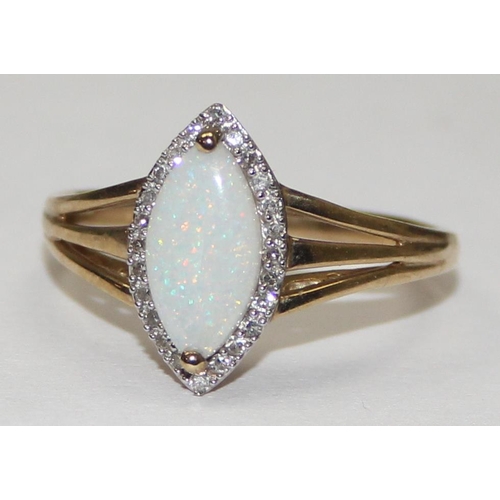 2059 - A 9ct gold lozenge shaped opal and small diamond ring, full English hallmarks, approx size U, approx... 