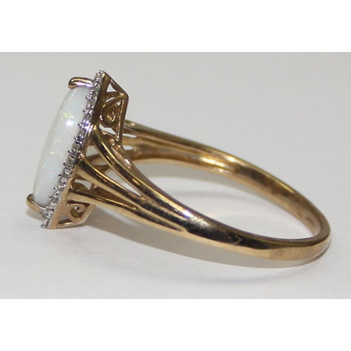 2059 - A 9ct gold lozenge shaped opal and small diamond ring, full English hallmarks, approx size U, approx... 