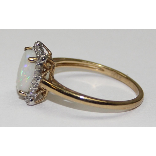 2060 - A 9ct gold cushion shaped opal and small diamond ring, full English hallmarks, approx size T, approx... 