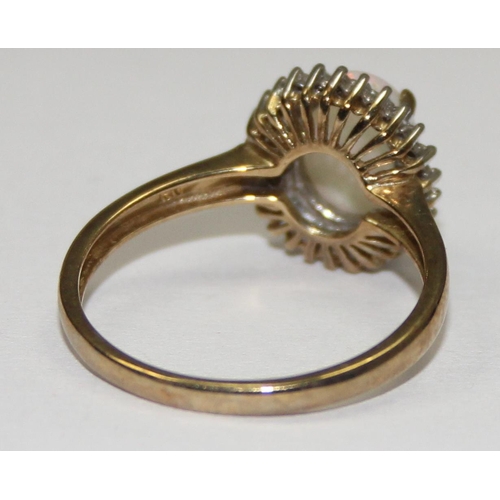 2061 - A 9ct gold oval shaped opal and small diamond ring, full English hallmarks, approx size S, approx 2.... 