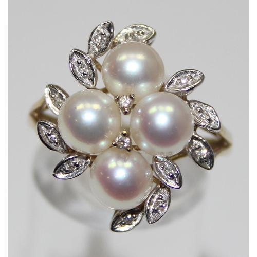 2064 - A 9ct gold pearl and diamond cluster ring with leaf shaped settings, full English hallmarks, approx ... 