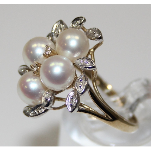 2064 - A 9ct gold pearl and diamond cluster ring with leaf shaped settings, full English hallmarks, approx ... 