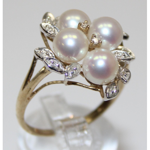 2064 - A 9ct gold pearl and diamond cluster ring with leaf shaped settings, full English hallmarks, approx ... 