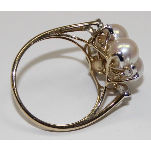 2064 - A 9ct gold pearl and diamond cluster ring with leaf shaped settings, full English hallmarks, approx ... 