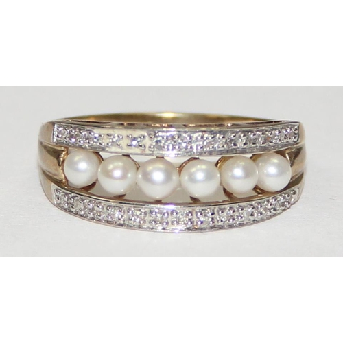 2065 - A 9ct gold seed pearl and diamond half eternity band ring, full English hallmarks, approx size T, ap... 