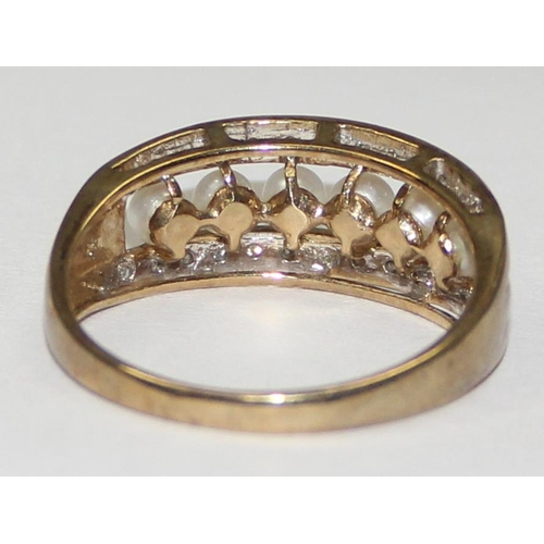 2065 - A 9ct gold seed pearl and diamond half eternity band ring, full English hallmarks, approx size T, ap... 