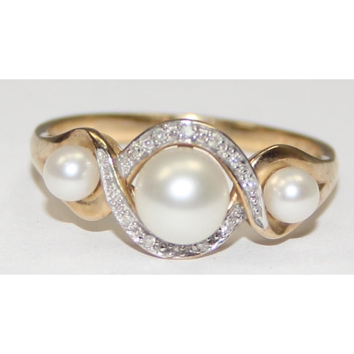 2066 - A 9ct gold trilogy pearl and small diamond ring, full English hallmarks, approx size U, approx 3.09g... 