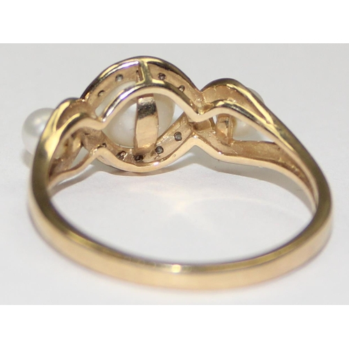 2066 - A 9ct gold trilogy pearl and small diamond ring, full English hallmarks, approx size U, approx 3.09g... 