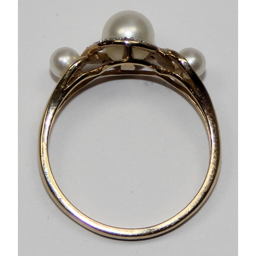 2066 - A 9ct gold trilogy pearl and small diamond ring, full English hallmarks, approx size U, approx 3.09g... 