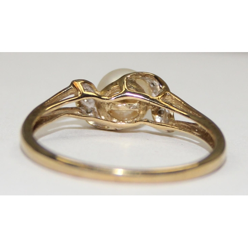 2067 - A 9ct gold solitaire pearl and small diamond ring, full English hallmarks, approx size U, approx 2.1... 