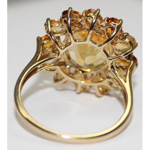 2075 - A 9ct gold floral set citrine dress ring, full English hallmarks, approx size U, approx 4.17g gross