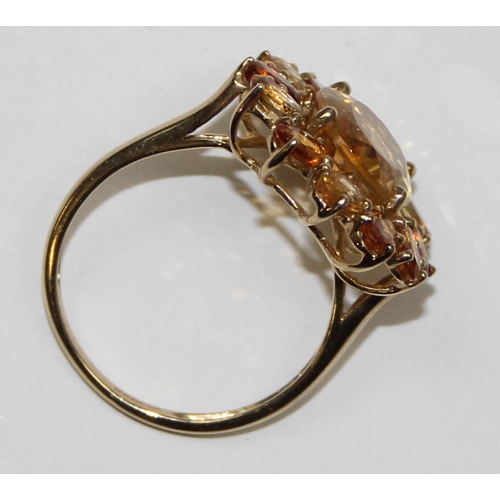 2075 - A 9ct gold floral set citrine dress ring, full English hallmarks, approx size U, approx 4.17g gross