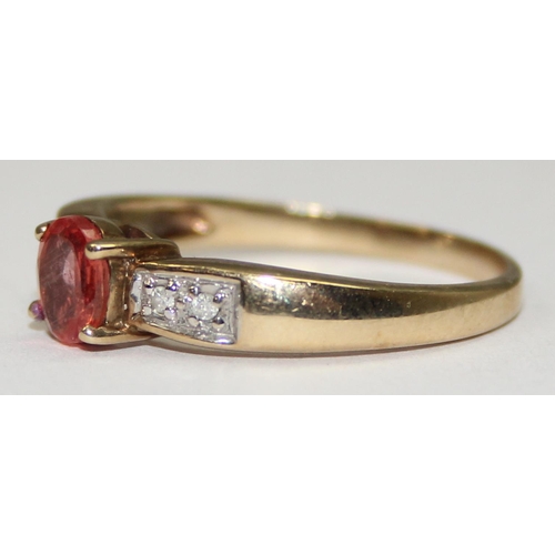 2082 - A 9ct gold light orange stone ring flanked by diamond shoulders, full English hallmarks, approx size... 