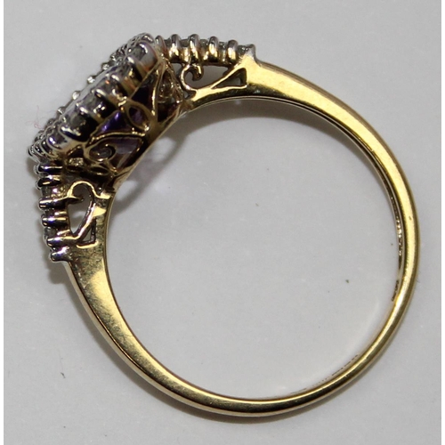 2086 - A 9ct gold antique style light purple stone cocktail ring surrounded by small diamonds, full English... 